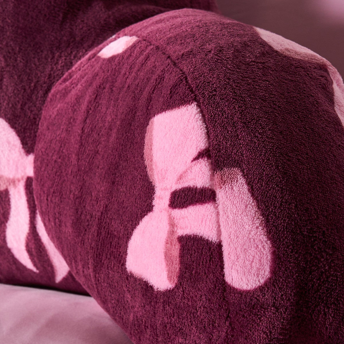 Bow Print Cuddle Cushion - Burgundy 🇬🇧